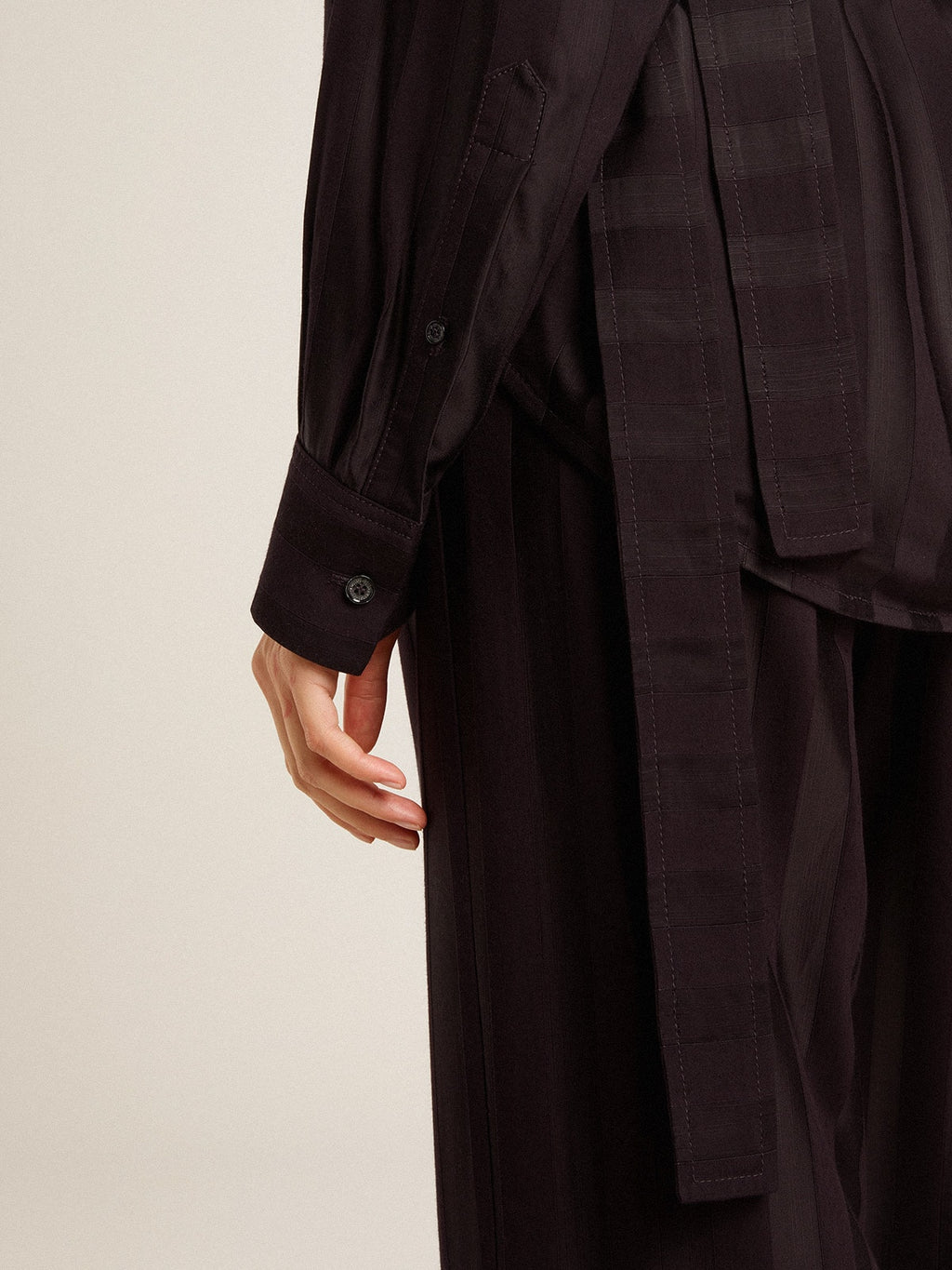 Women's black shirt with vertical stripes and side knot closure