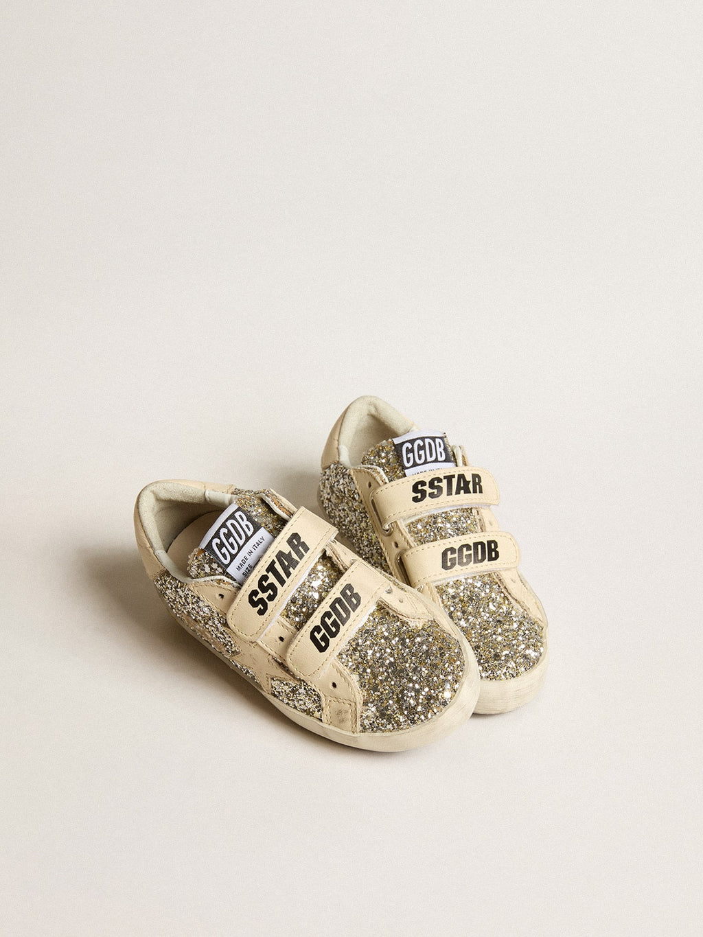 Old School Young in platinum glitter with leather star and heel tab