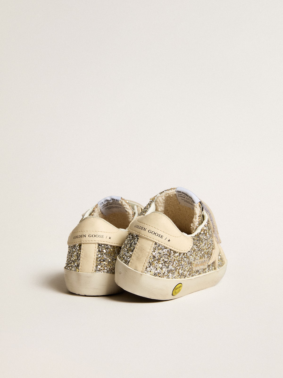 Old School Young in platinum glitter with leather star and heel tab