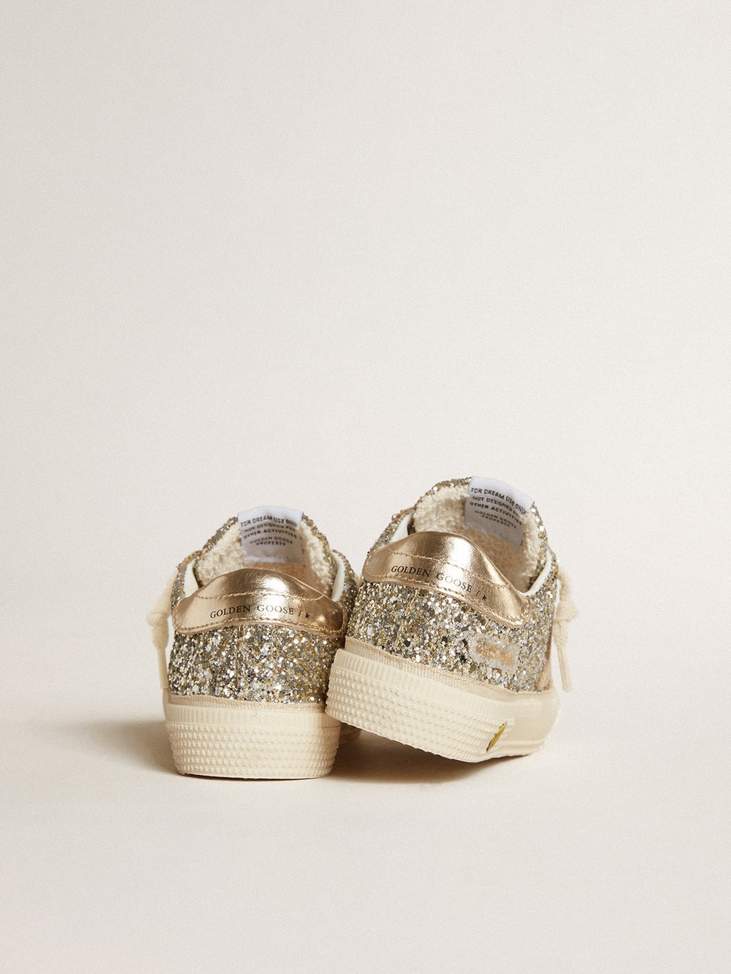 May Young in platinum glitter with metallic leather star and heel tab