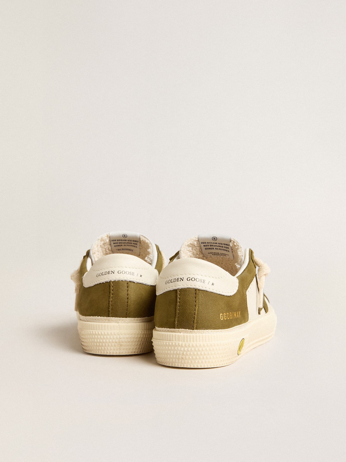 May Young in white and military green leather